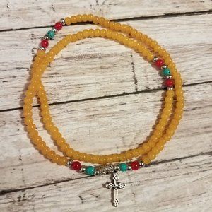 Yellow stretchy bracelet with cross charm